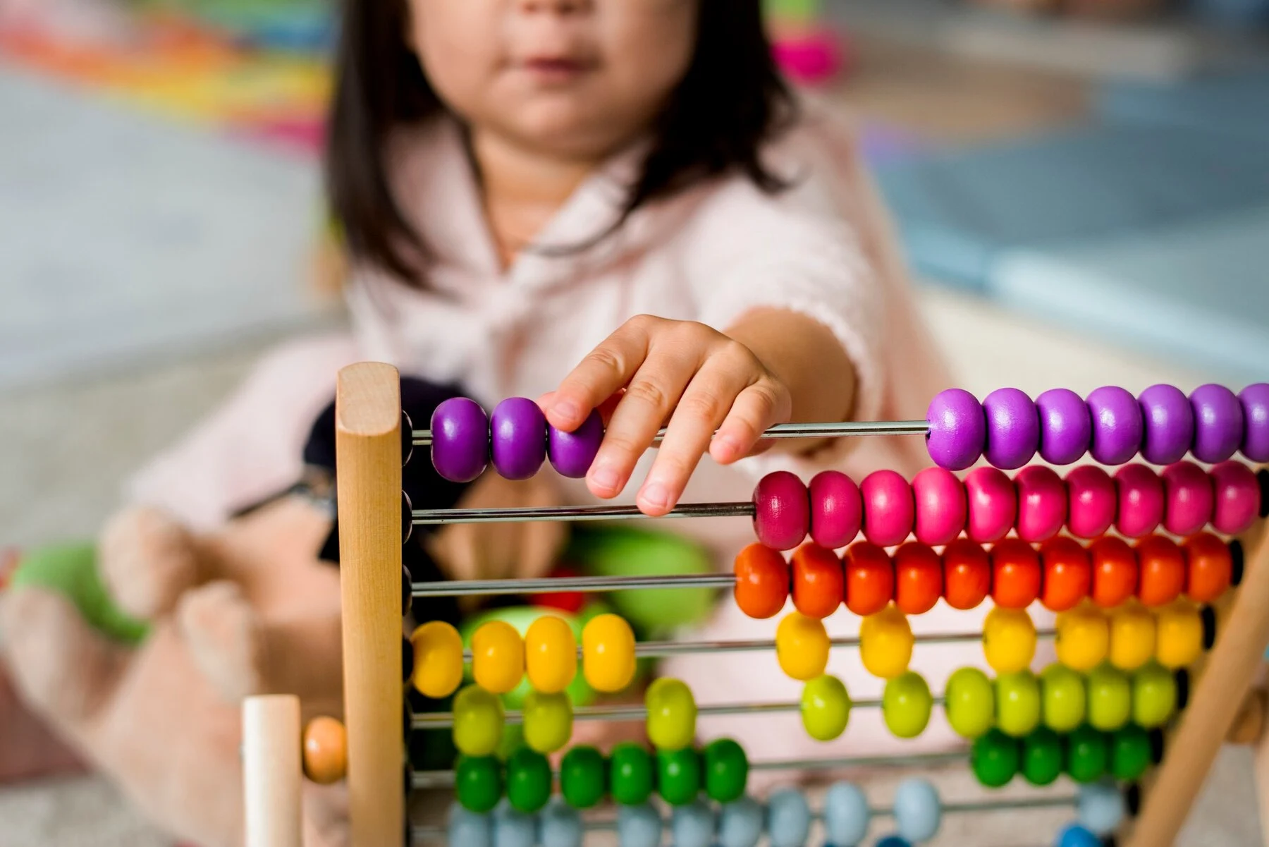 little-girl-playing-abacus-counting toy